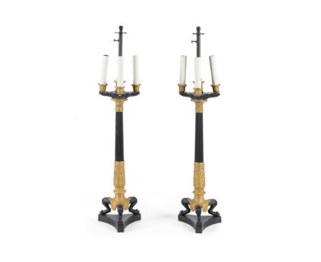 A PAIR OF LARGE PATINATED AND GILT METAL TABLE LAMPS IN EMPIRE STYLE LATE 20TH CENTURY,Now wired as lamps each 83.5cm high to