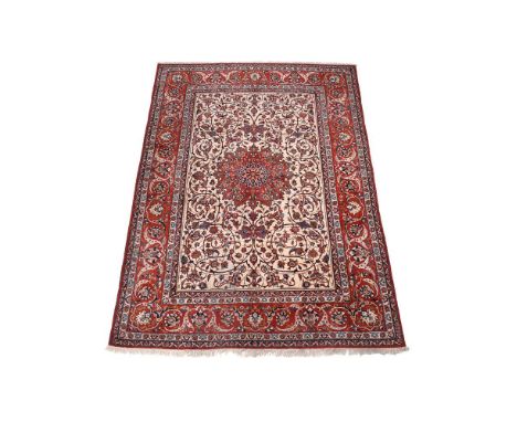 AN ISFAHAN CARPETapproximately 360 x 276cmCondition Report: The rug with some dirt and discolouration, would benefit from a l