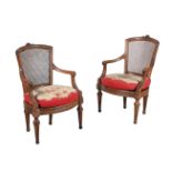A PAIR OF NORTH ITALIAN CARVED WALNUT ARMCHAIRS