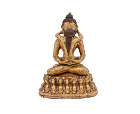 A GILT BRONZE FIGURE OF BUDDHA IN SINO-TIBETAN STYLEPROBABLY CHINESE, 20TH CENTURYThe deity seated on a lotus throne in yab-y