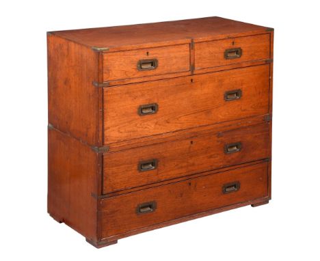 A LATE VICTORIAN TEAK CAMPAIGN CHESTBY ARMY & NAVY C.S.L MAKERSBearing an ivorine plaque to upper drawer: 'ARMY & NAVY C.S.L.