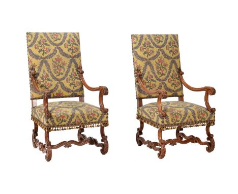 A PAIR OF CARVED WALNUT AND UPHOLSTERED OPEN ARMCHAIRS IN LOUIS XIV STYLEEARLY 20TH CENTURY120cm highCondition Report: Marks,