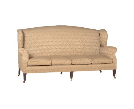 A MAHOGANY AND UPHOLSTERED SOFA IN GEORGE III STYLEEARLY 20TH CENTURYWith wing arms113cm high, 221cm wide, 85cm deepCondition