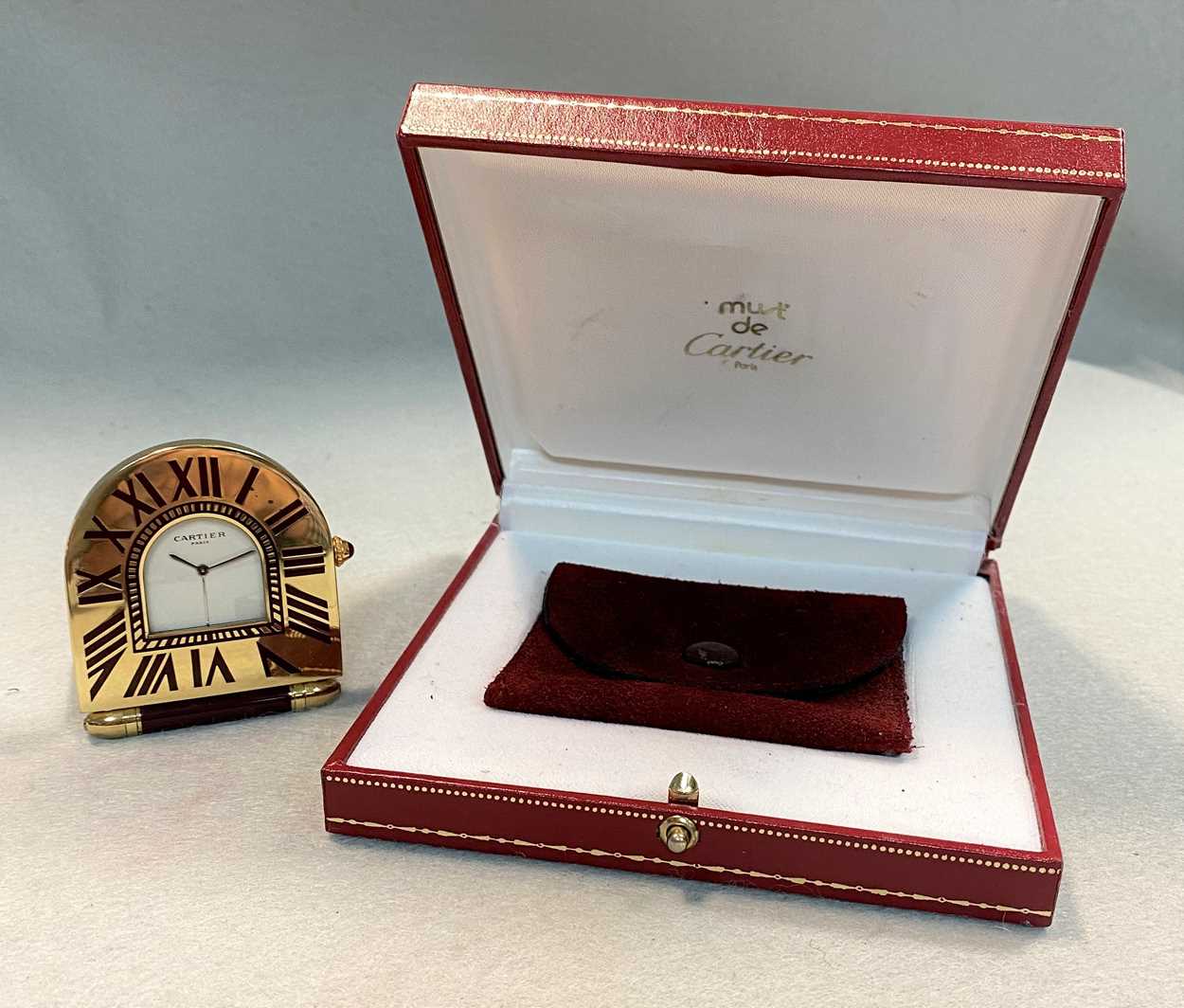 Cartier A 'must de Cartier' travelling alarm clock and ballpoint pen