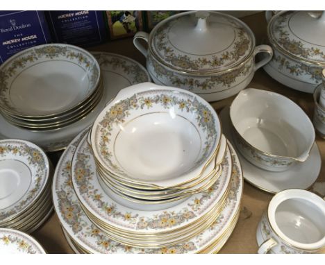 A Noritake fine China dinner set with tureens diner plated bowls cups and saucers and a tea pot some cups chipped pattern wor