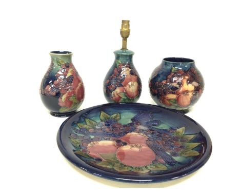 A collection of Moorcroft Finchs and berries porcelain including vases (17 to 19cm tall), a plate (diameter of 35cm) and a la