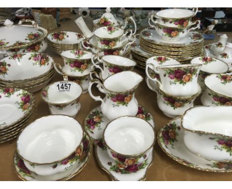 A collection of Royal Albert Country Roses tea/dinner service, including tureen, gravy boat, tea plates, dinner plates etc
