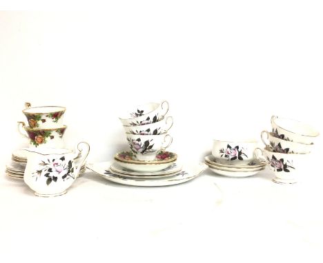 A Royal Albert Queens Messenger porcelain tea set, with some Old Country Rose cups and saucers. Postage cat D  NO RESERVE