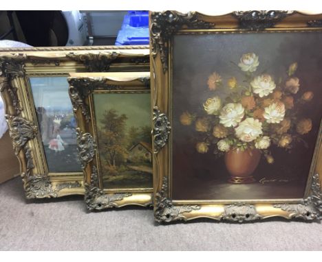 A collection of framed watercolour and oil paintings consisting of a floral oil painting signed Robert Cox (1934-2001), an oi