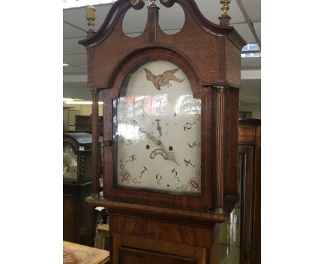 An inlaid oak and mahogany cross banded longcase clock eight day going with a white dial.