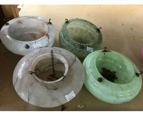 Four glass hanging lamp shades in pink and green