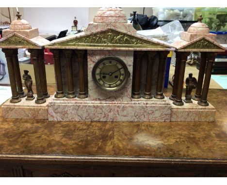 A Victorian pink marble clock set of classical form the dial with Roman numerals .