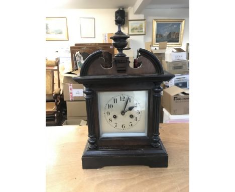 Vintage Oak clock with square silvered dial, in working order with key and pendulum. 10c28x30cm Postage cat D