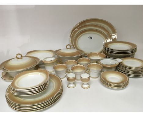 A Shelley Art Deco design porcelain dinner service with cups saucers tureens graduating serving plates. Soup and dessert bowl