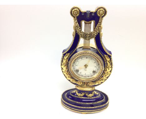 A replica Marie-Antoinette clock from the Victoria and Albert museum. 33cm tall.