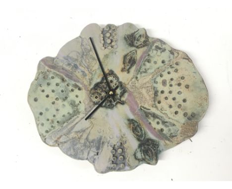 A contemporary ceramic wall clock with impressed pattern. Attributed to Bernard Rooke. 30x25cm NO RESERVE