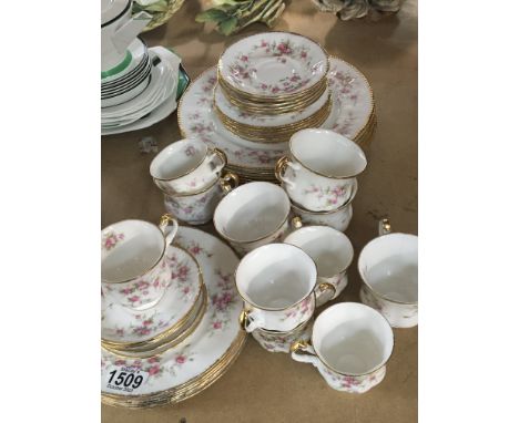 A Paragon  and Royal Albert Victoriana Porcelain part service comprising dinner plates side plates tea and coffee cups and sa