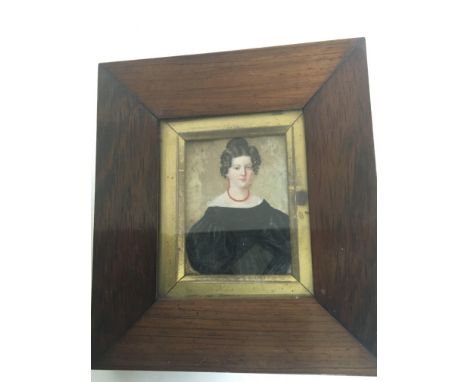 A Victorian Rosewood framed portrait miniature of a young lady with black dress. 8x7cm