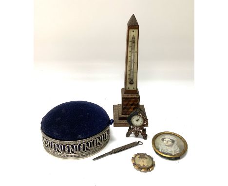 A Tunbridgware obelisk thermometer (A/F), Hallmarked silver hat pin stand, champleve enamel miniature clock marked Brevet D.R