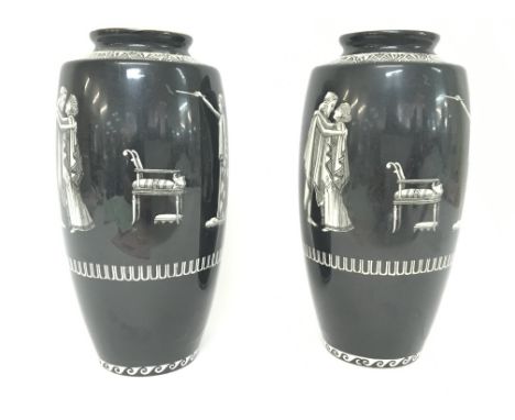 A pair of Falcon Ware J.H.W & Sons black and white ceramic vases, postage category D approximately 22cm tall.