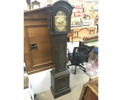 An Oak Grandmother clock with a brass dial, 160cm tall. Postage category D. NO RESERVE