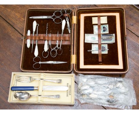 A ladies leather cased sewing set with mother of pearl handled carved button hook, cork screw, crochet hook, etc, with cased 