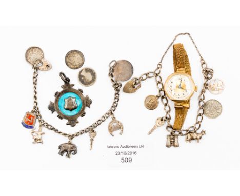 A silver guilloche enamelled shield fob engraved for 1917; together with a silver 3d charm bracelet and ladies, rolled gold v