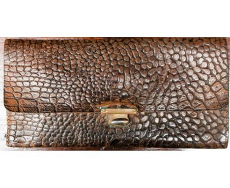 A snakeskin late Edwardian purse, with metal fastener, with a tiny purse and mirror inside 