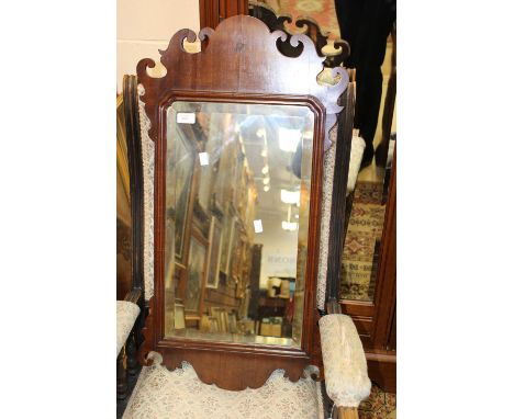 A George III mirror with swan neck style cut detail 