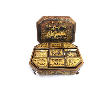 A 19th Century Chinese black lacquer games compendium, circa 1820, of sarcophagus form decorated with an extensive chinoiseri