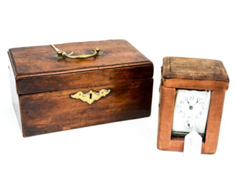 A late 19th Century carriage clock, white enamelled face with black Arabic numerals dial, alarm subsidiary dial numbered one 