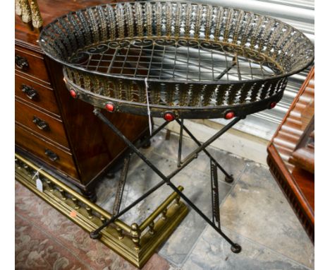 A 20th Century brass fender, with galleried sides, together with a wrought iron style planter, with cabouchon decoration, (2)