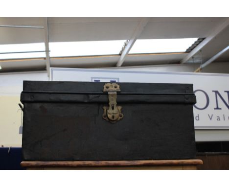An early 20th Century tin trunk, military interest, bearing a name on top, two handles red painted interior