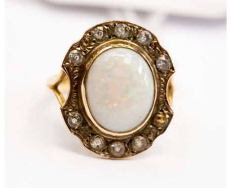 Opal and white stone yellow metal ring, ring size L, gross weight approx 3.4 grams