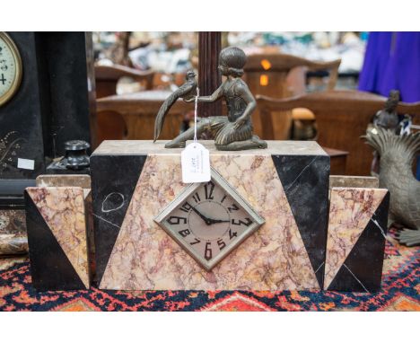 An Art Deco style three piece marble mantel clock, diamond shaped dial with stylised numbers with a child holding a Pheasant 