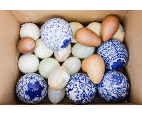 Five Chinese ceramic carpet bowls, six alabaster balls, seven onyx eggs, five wooden eggs 