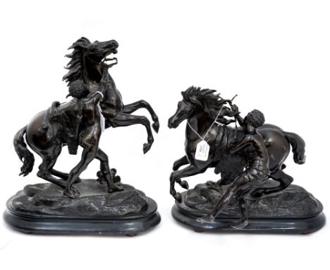 A pair of spelter mantelpiece sculptures of a fiery Horse with handler/controller, signed Coustou (af) bronzed effect on plin