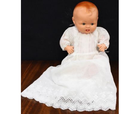 A circa 1947 ceramic baby doll, wearing broderie anglais Christening gown 