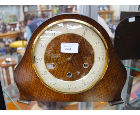 An oak mantle clock 