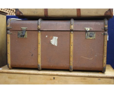 An early 20th Century canvas and wood bound trunk, initialled 'JWL'