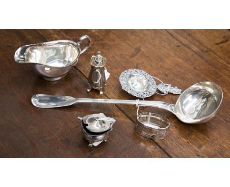 A white metal Fiddle and Thread pattern soup ladle; together with a white metal napkin ring, a tea strainer and a small parce