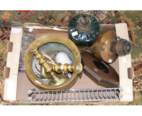 A box of metalware to include a brass jardiniere, an oil lamp with blue glass reservoir, brass candlesticks, etc 