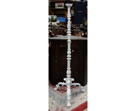 A white painted 20th Century cast iron standard lamp.