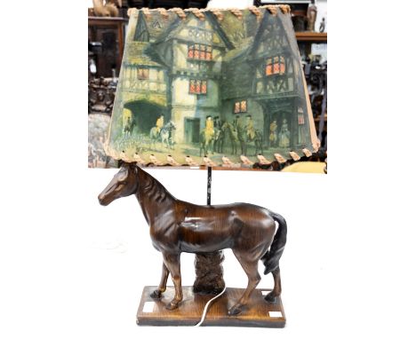 A table lamp with plaster base moulded as a horse with shade.