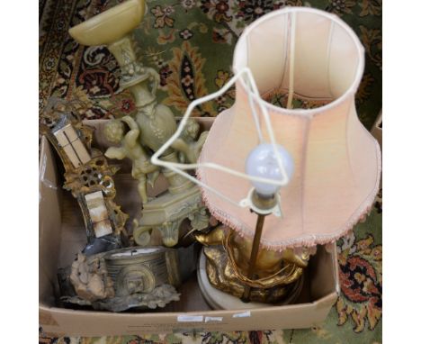 Two gilt metal table lamps, both with cherubs, on white marble bases, together with a late nineteenth century gilt metal Fren