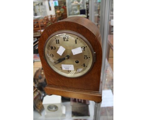 An Edwardian German table mantle clock, silvered dial