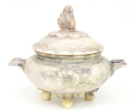 An alabaster raised bowl and cover, in an oriental style, the finial is a stylised lotus flower and the handles are styled as