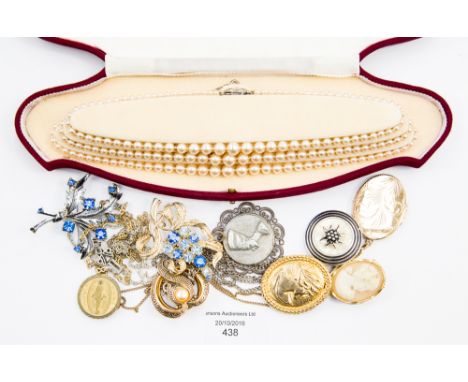 A rolled gold locket and chain, a white metal Queen Nephertiti pendant and chain and two other pendants and chains; together 
