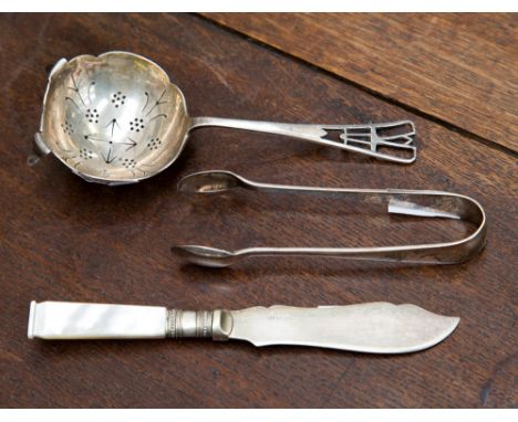 A silver tea strainer in Secessionist style, Sheffield, 1940, maker Viners Limited, a pair of sugar tongs, Sheffield 1938, ma