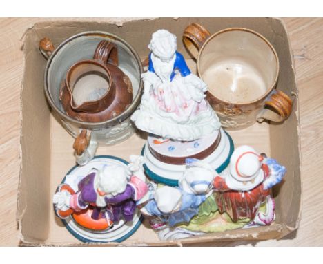 An early 20th Century stoneware loving cup with raised hunting scenes; together with a matching jug and a stoneware tyg, meta